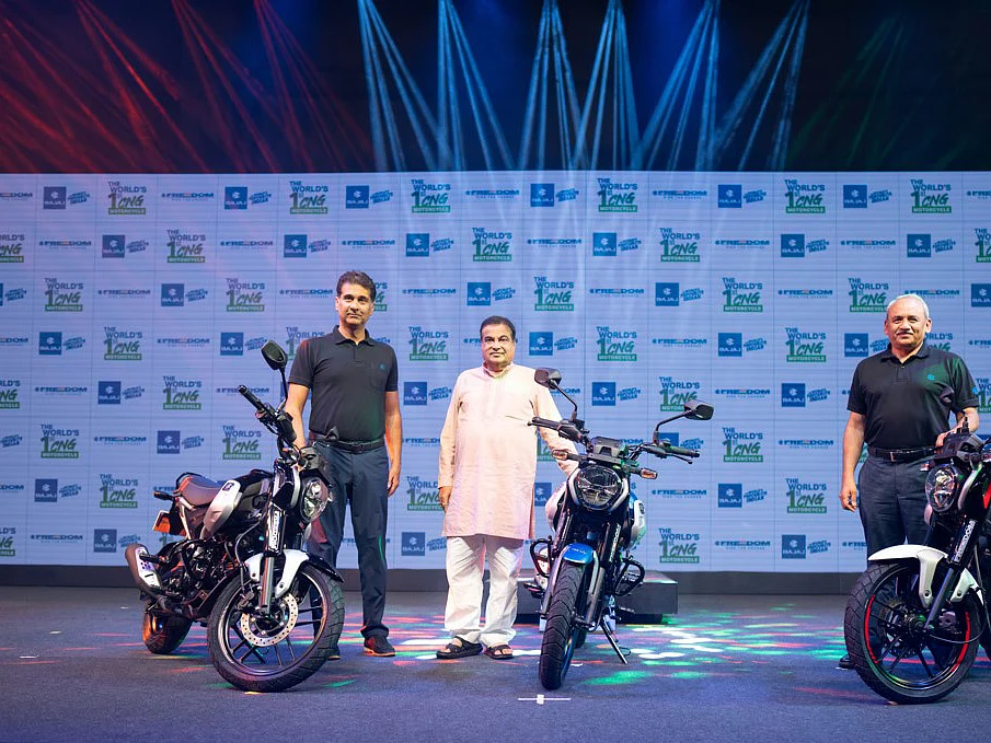 Bajaj Auto managing director Rajiv Bajaj (left) with Union minister Nitin Gadkari at the launch of CNG motorcycle Freedom.