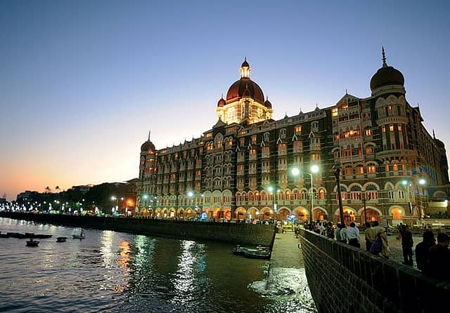 TATA's DIVERSE FOOTPRINT: (From left) A Westside store (run by Trent) in Pacific Mall, Ghaziabad; employees walk through a rest area at a TCS campus in Chennai; the Taj Mahal Palace Hotel near Mumbai’s Gateway of India