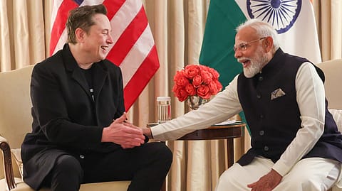 Tesla CEO Elon Musk (left) with Prime Minister Narendra Modi