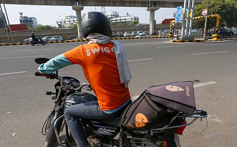 A Swiggy delivery partner on the roads of Gurugram, Haryana.