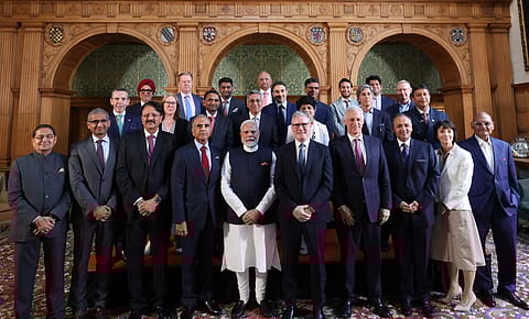 Prime Minister Narendra Modi and UK Prime Minister Keir Starmer with business leaders.