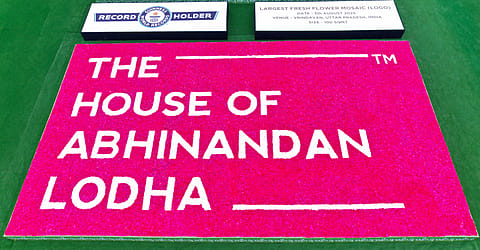 The company says spanning 100 square metres, the mosaic was made using thousands of fresh red and white carnations, arranged over a custom-built floral platform.