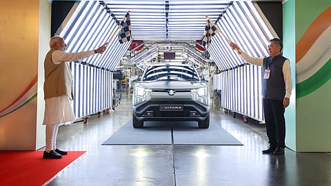 PM Narendra Modi and Toshihiro Suzuki, Representative Director and President, Suzuki Motor Corporation, flag off the e-Vitara from Plant C of the Suzuki Motor Gujarat plant in Hansalpur, Gujarat.