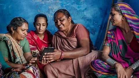 Younger SEWA members train older members using cellphones to expand their microbusinesses using digital payments.
