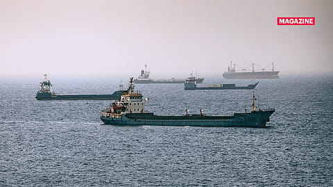Crude oil tankers, bulk carriers, and vessels sit anchored around Qaboos Port on June 22 in Muscat, Oman.