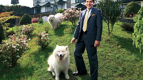 Brij Raj Oberoi, founder and managing director of the Elgin Group, with his pets Mickey and Rosé (behind).