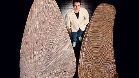 Jay Gorsia with a table (left) and a settee designed by him.