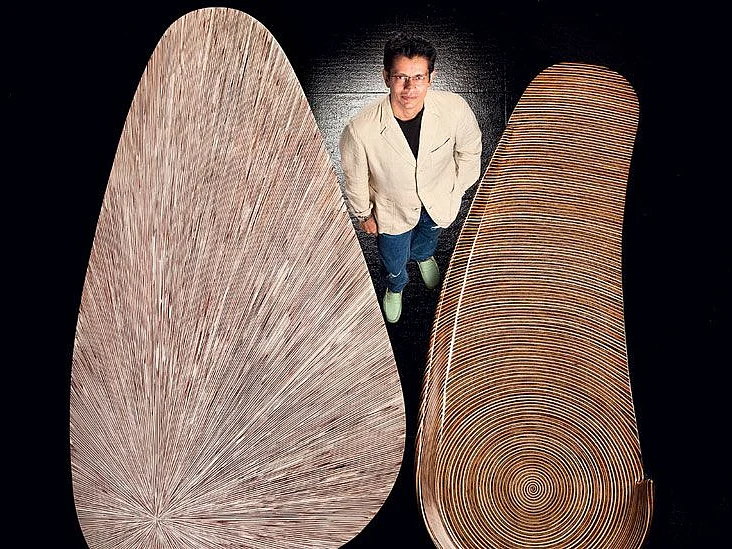 Jay Gorsia with a table (left) and a settee designed by him.