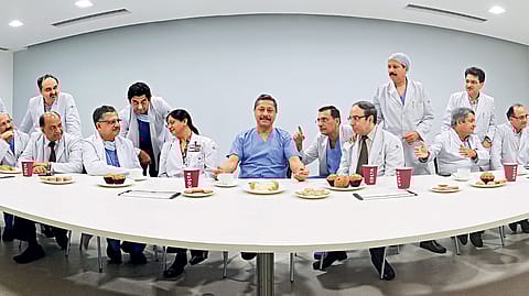 DR. Naresh Trehan (in blue) is the pivot on which Medanta The Medicity revolves. He is seen here surrounded by the heads of the hospital’s departments.