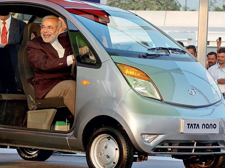 Gujarat chief minister Narendra Modi tests a Tata Nano 