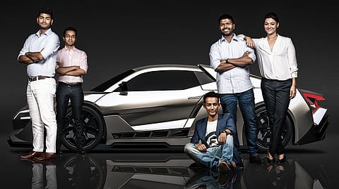 The machinists: Sarthak Paul Chowdhury (far left) is leading a team whose Indian members have an average age of 23; car image rendered by company.