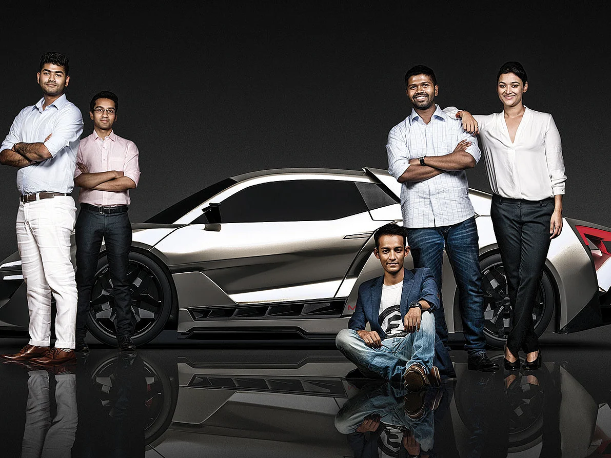 The machinists: Sarthak Paul Chowdhury (far left) is leading a team whose Indian members have an average age of 23; car image rendered by company.