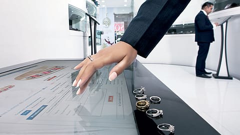 At Caratlane.com’s New Delhi store, customers walk in and check out the entire range of solitaires on iPads and a large table running Microsoft Surface.