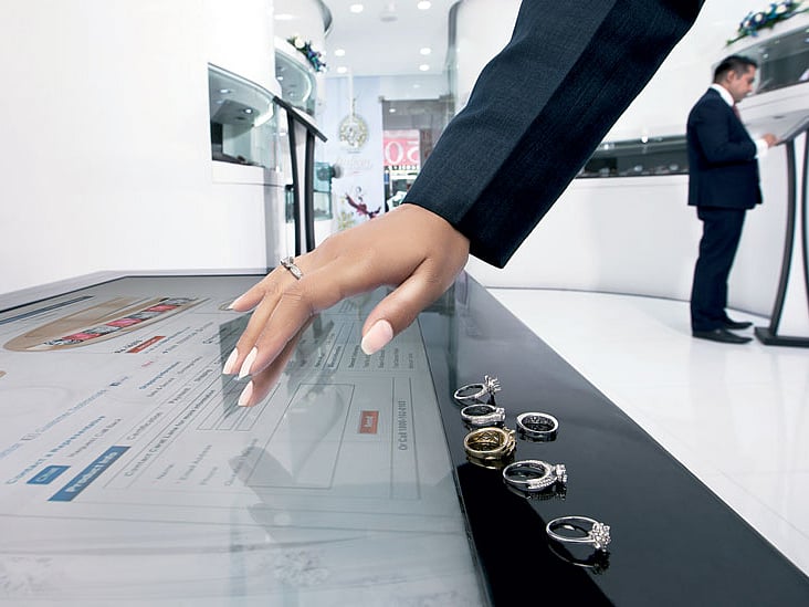 At Caratlane.com’s New Delhi store, customers walk in and check out the entire range of solitaires on iPads and a large table running Microsoft Surface.