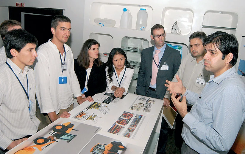 Tata Elxsi team members discuss an idea 