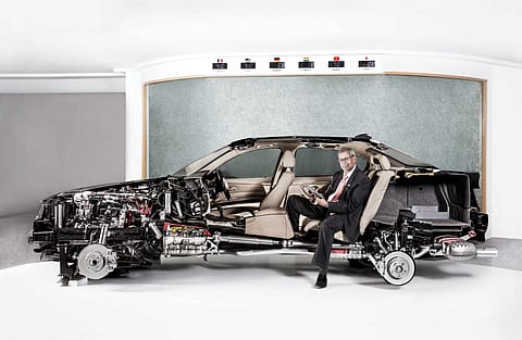 Soumitra bhattacharya, managing director, Bosch, and president, Bosch Group India, in a BMW showing the complex workings of a Bosch powered car. 