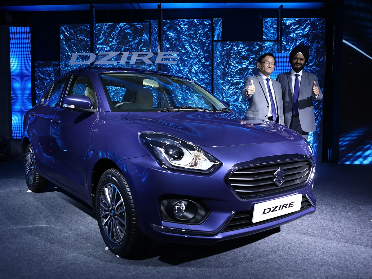 Kenichi Ayukawa, MD &amp; CEO, Maruti Suzuki India,(left) and R S Kalsi, ED, M&amp;S Maruti Suzuki India Ltd, (right) launch the authentic all-new Dzire on 16 May 2017 in New Delhi.&nbsp;