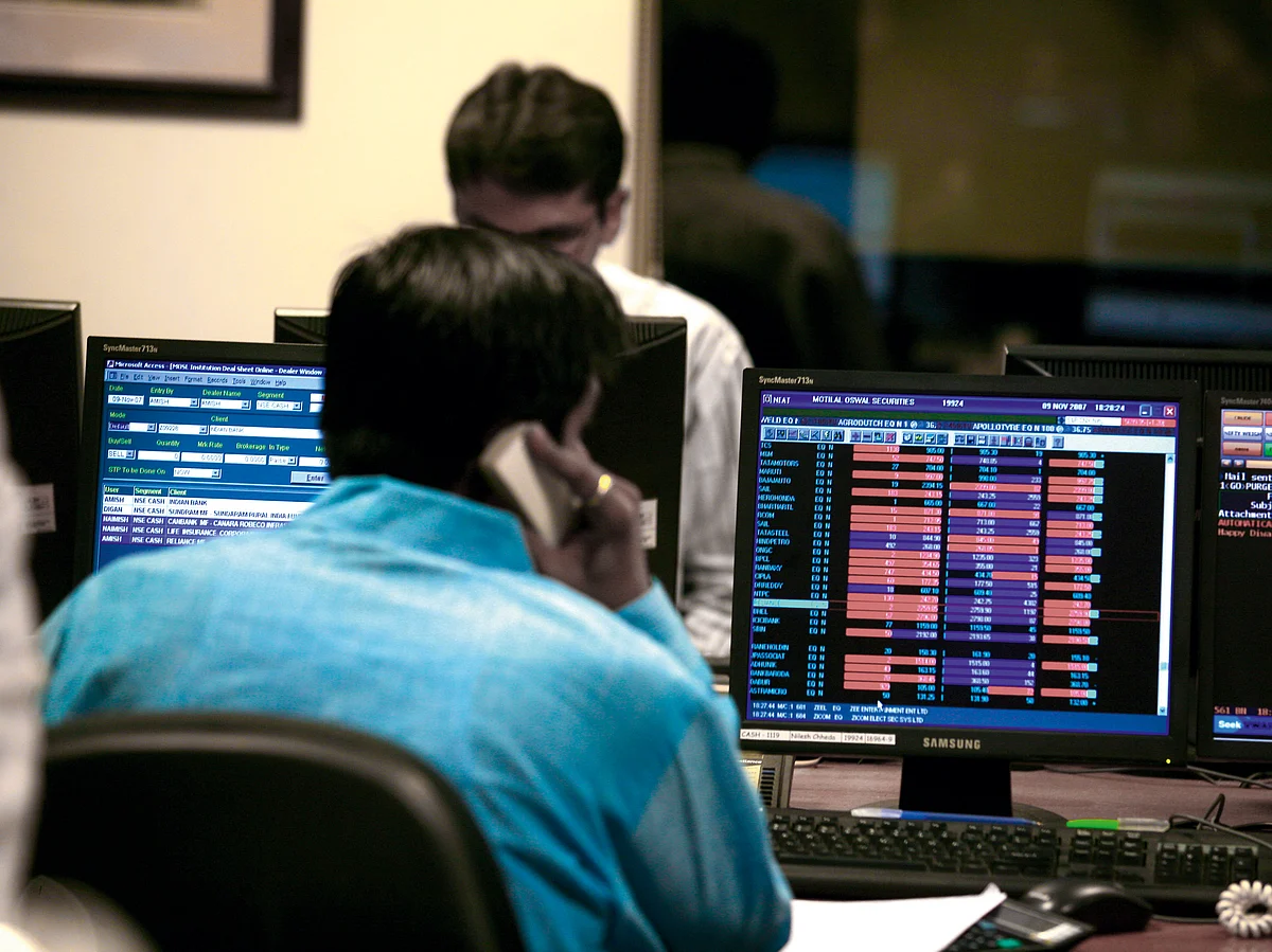  Stock brokers doing tradingmarking beginning of new trading year after Lakshmi puja performed in brokers Bombay Mumbai.