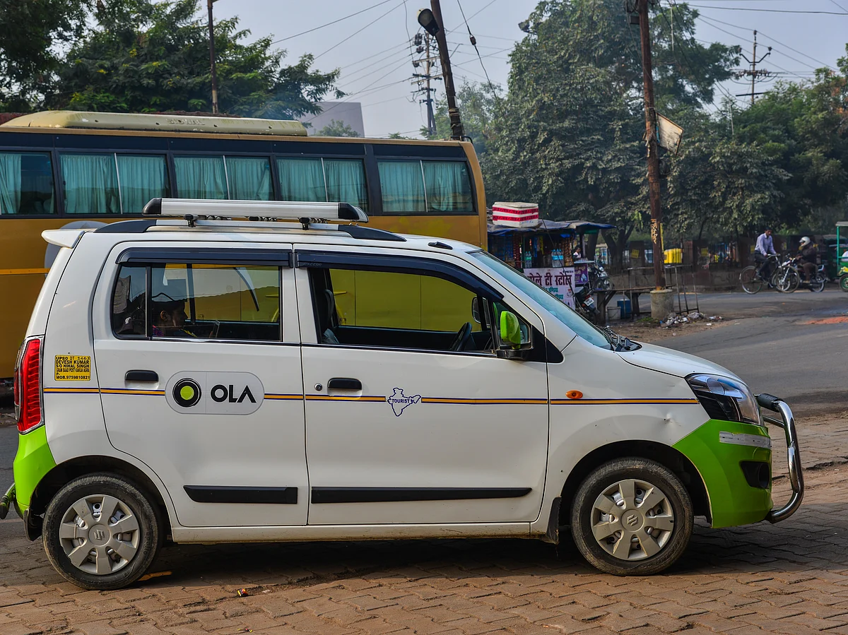 An Agra-registered cab with the Ola livery