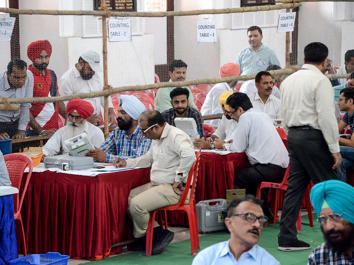 Indian election officials check an Electronic Voting Machine (EVM) at a polling counting centre in Amritsar on May 23, 2019.