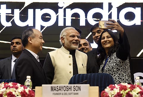 Prime Minister Narendra Modi poses for a selfie with young founders of companies at the launch of Start-Up India at Vigyan Bhavan on January 16, 2016 in New Delhi.