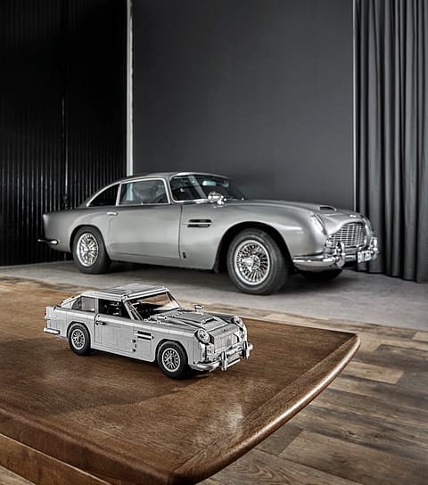 The real Aston Martin DB5 with the LEGO creation in the foreground.