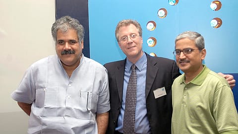 Bruce Ashby (C), former president and CEO, IndiGo Airlines, and co-founders Rahul Bhatia (L) and Rakesh Gangwal at a press conference in New Delhi on July 31, 2006.