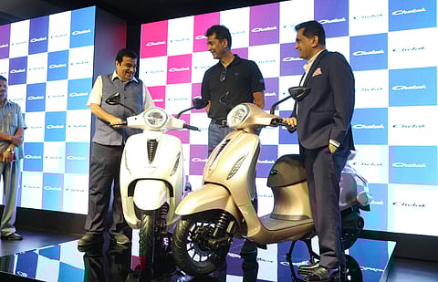 <em>(From left) Nitin Gadkari, </em>Union minister for road transport and highways, Rajiv Bajaj, managing director of <em>Bajaj</em> Auto, and Amitabh Kant, CEO of NITI Aayog during the launch of Bajaj Auto’s first electric scooter in New Delhi on October 16, 2019. 