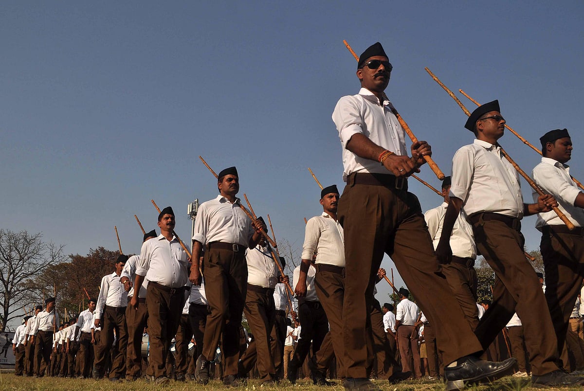 RSS workers take part in <i>Path Sanchalan</i> ahead of Hindu New year celebration in Allahabad.