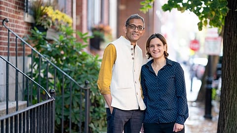 MIT economists Abhijit Banerjee and Esther Duflo stand outside their home after learning that they have been named co-winners of the 2019 Nobel Prize in economic sciences. They will share the prize with Michael Kremer of Harvard University.