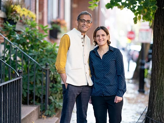 MIT economists Abhijit Banerjee and Esther Duflo stand outside their home after learning that they have been named co-winners of the 2019 Nobel Prize in economic sciences. They will share the prize with Michael Kremer of Harvard University.