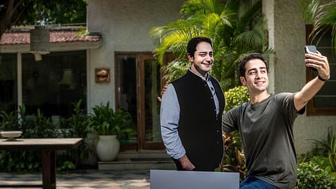 Good Capital’s Arjun Malhotra with a cutout of his brother Rohan.