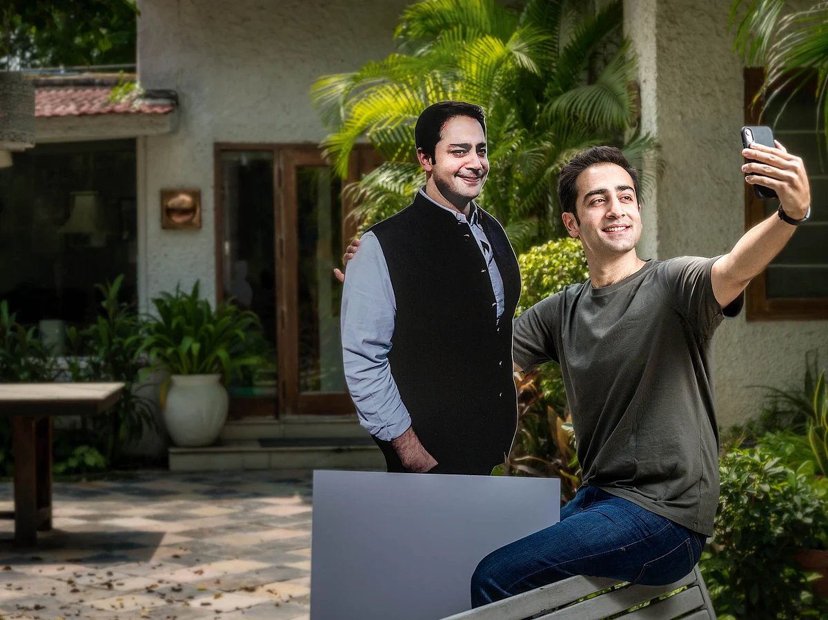 Good Capital’s Arjun Malhotra with a cutout of his brother Rohan.