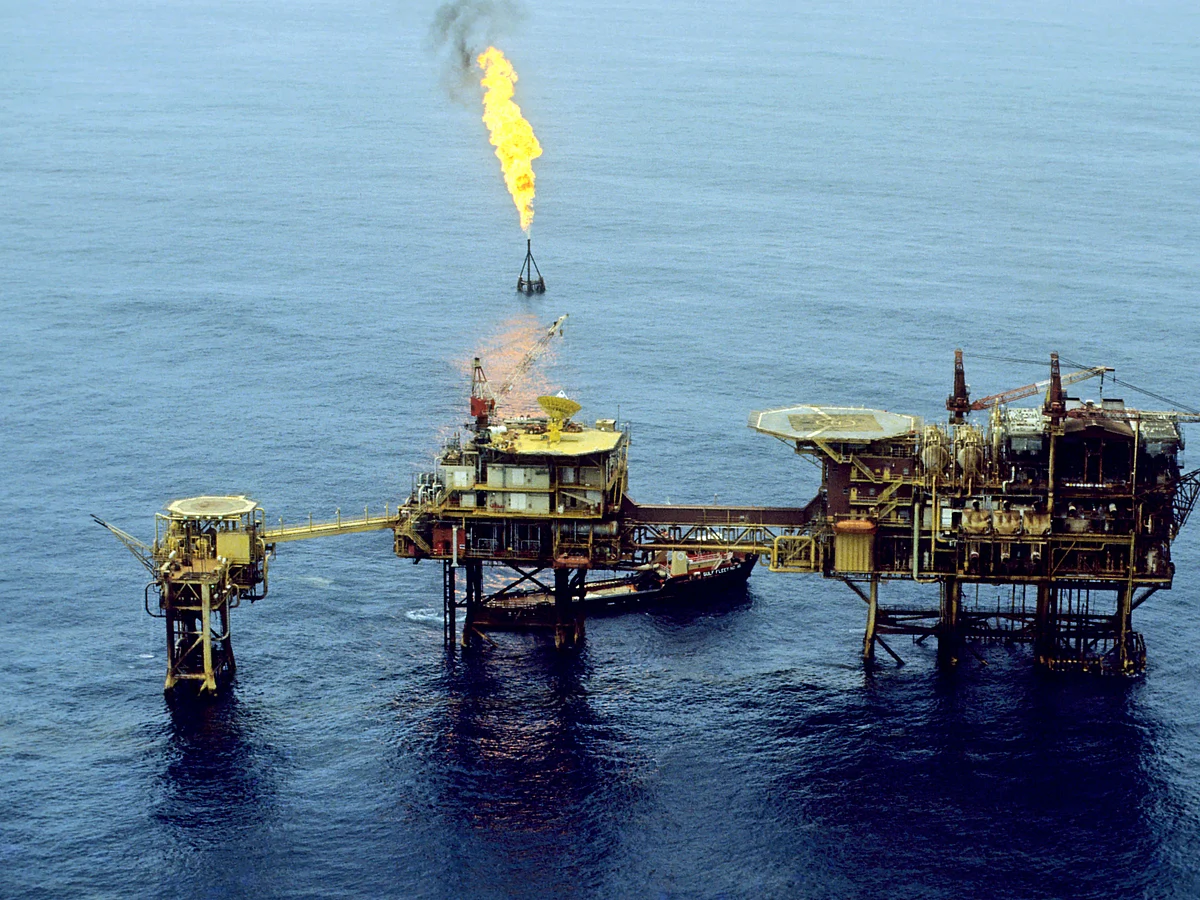 Gas flame on offshore oil platform burning off waste gas