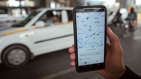Booking cab on Uber app.
