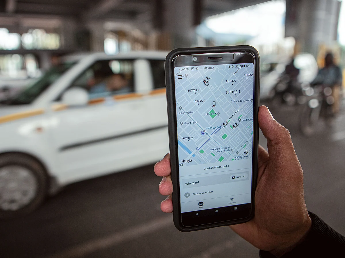 Booking cab on Uber app.