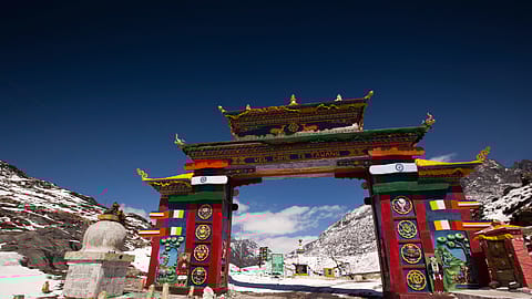 Arunachal Pradesh, Sela Pass, high altitude road passing under colourful gateway to Tawang.