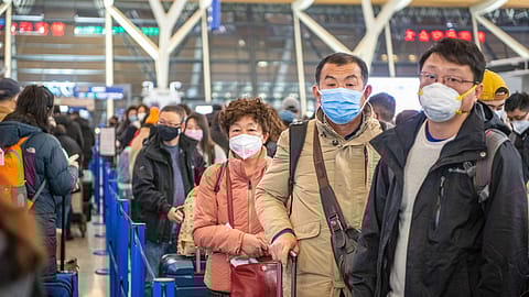 Shanghai, China, 28th Jan 2020, People standing in line at the airport wear medical masks to prevent contracting the Coronavirus.<br>