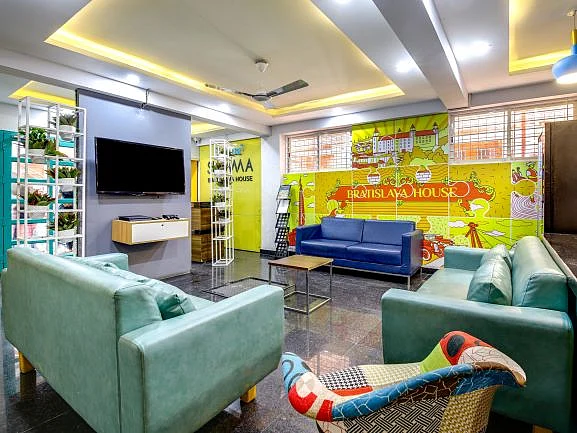 Stanza Living: Lobby area in a co-living accommodation for working professionals.
