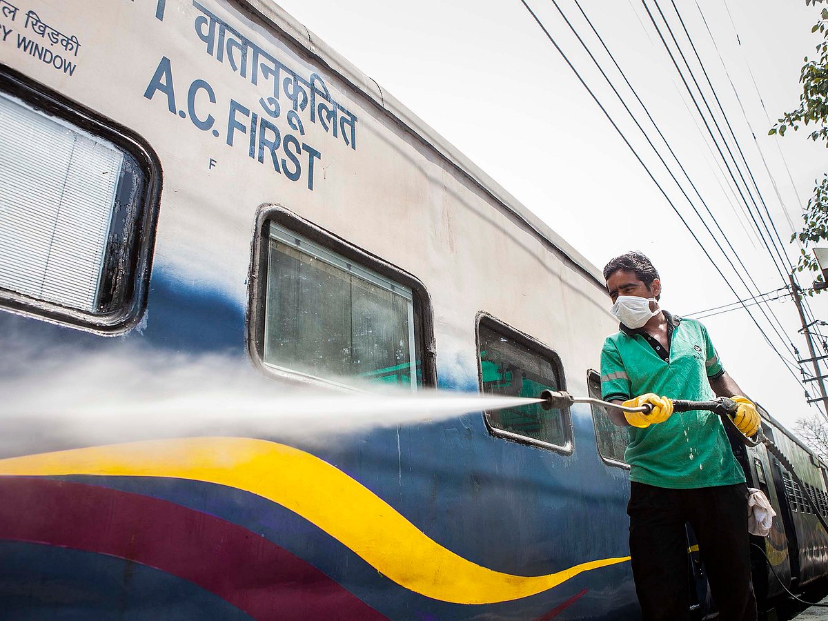 A worker disinfects a train.