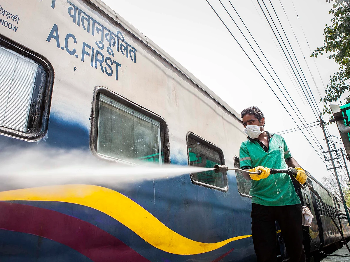 A worker disinfects a train.