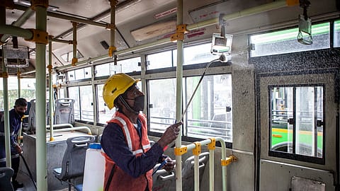 A worker disinfects a bus in New Delhi.