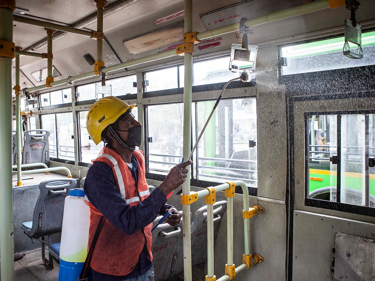 A worker disinfects a bus in New Delhi.