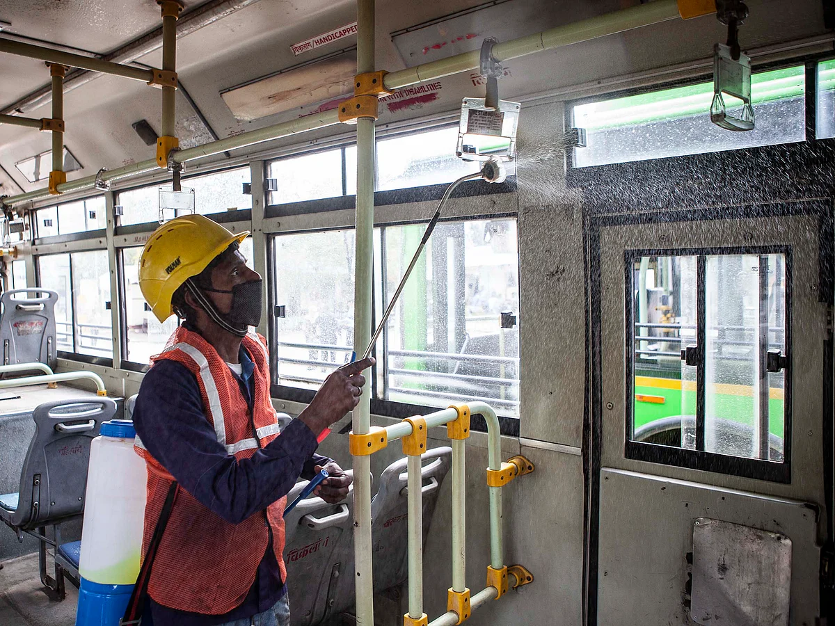 A worker disinfects a bus in New Delhi.