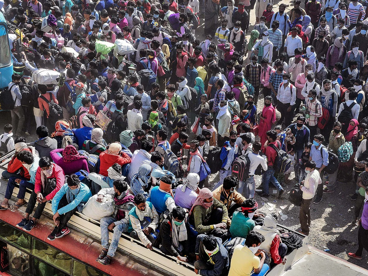 A SHOCKING AFFAIR: Migrant workers boarding buses arranged by the Uttar Pradesh government at Lal Kuan Bus Stand, Ghaziabad, on day five of the nationwide lockdown.