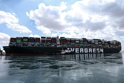 26 March 2021, Egypt, Suez: Two tugboats take part in the refloating operation carried out to free the "Ever Given", a container ship operated by the Evergreen Marine Corporation, which was stuck in the Suez Canal.