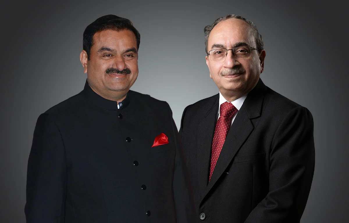 From Left: Gautam Adani,  chairman and founder of the Adani Group; Dinesh Kumar Khara, Chairman, State Bank of India.