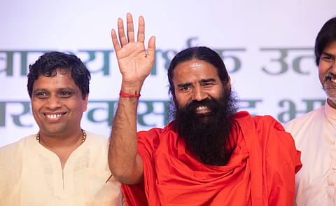 Yoga guru Baba Ramdev and Patanjali Ayurved MD & CEO Acharya Balkrishna