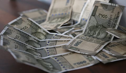 The Indian rupee fell to 77.69 amid negative cues from the global markets and dismal economic outlook back home.