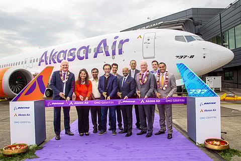 Akasa Air and Boeing officials with the airline's first Boeing 737 MAX aircraft in the background at the latter's Seattle facility.